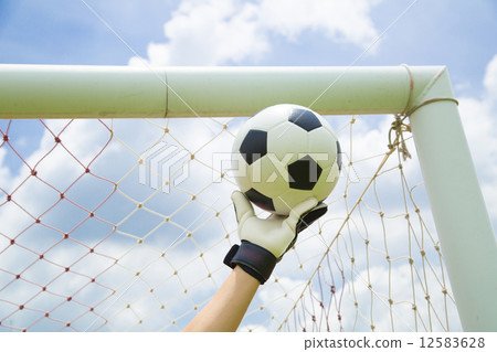 Goalkeeper used hands for catches the ball Goalkeeper used hands for catches the ball 12583628