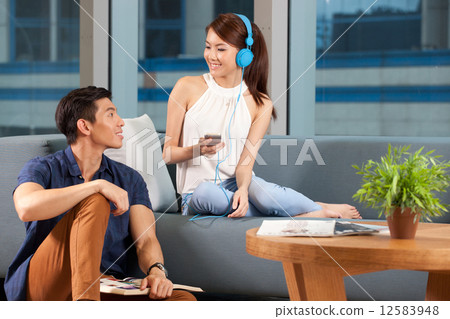 Asian couple relaxing at home 12583948
