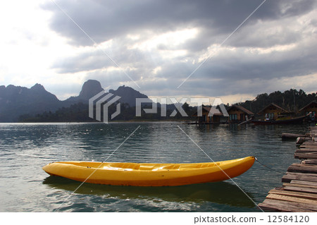 Kayak on Quiet Lake and cloudscape at Khao Sok , suratthani ,tha 12584120
