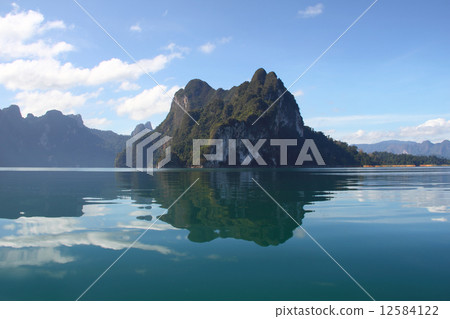 Beautiful reflecting mountain and sky at Khaosok National Park, 12584122