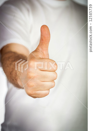 Hand showing thumb up 12585739