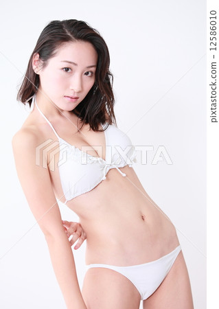 A young woman in a bathing suit 12586010