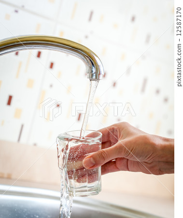 Water poured from tap to glass Water poured from tap to glass 12587170