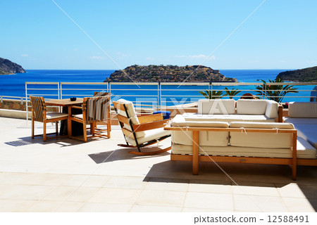 Sea view terrace at luxury hotel with a view on Spinalonga Islan Sea view terrace at luxury hotel with a view on Spinalonga Islan 12588491