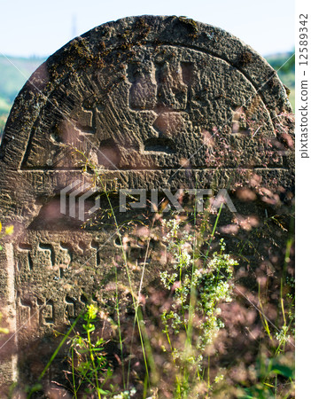 Gravestone in the old Jewish cemetery in the Ukrainian Carpathia Gravestone in the old Jewish cemetery in the Ukrainian Carpathia 12589342