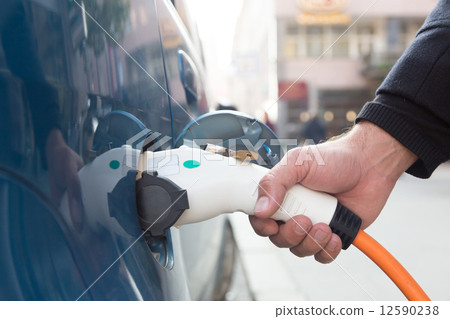 Electric Car in Charging Station. 12590238