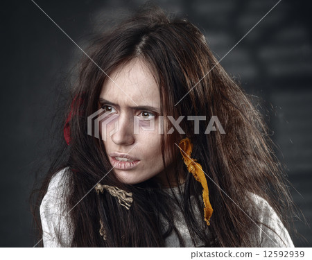Portrait of a crazy woman in a straitjacket 12592939