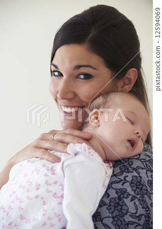 Mother Cuddling Sleeping Baby Daughter Mother Cuddling Sleeping Baby Daughter 12594069