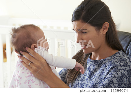 Frustrated Mother Suffering From Post Natal Depression 12594074