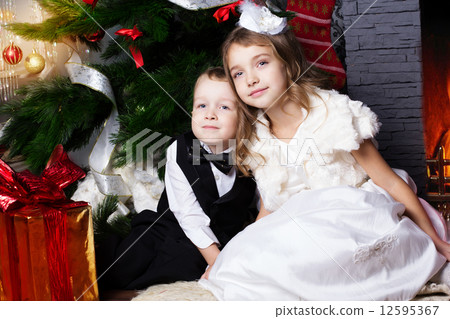 Happy children with christmas presents 12595367