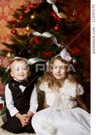 Happy children with christmas presents Happy children with christmas presents 12595570
