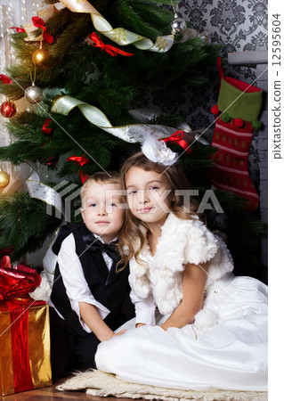 Happy children with christmas presents Happy children with christmas presents 12595604