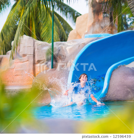 Child on water slide Child on water slide 12596439