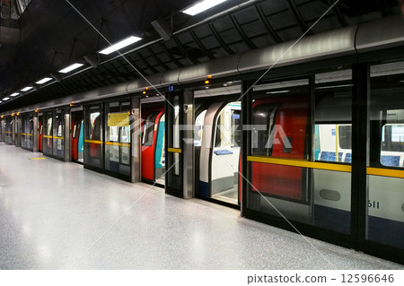 Train stopping at the North, North Greenwich subway station in London 12596646