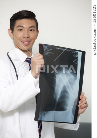Chinese male doctor holding xray 12601225
