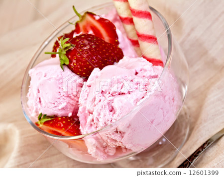 Ice cream strawberry in glass bowl with waffles on fabric Ice cream strawberry in glass bowl with waffles on fabric 12601399