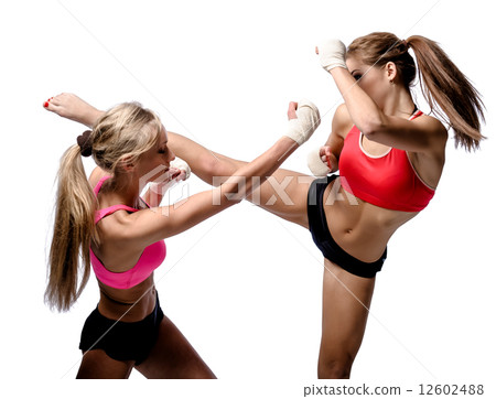 Two attractive athletic girls fighting over white background Two attractive athletic girls fighting over white background 12602488