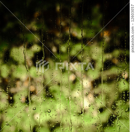 Water raindrops on a window glass Water raindrops on a window glass 12603057