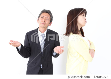 An angry wife (housewife) and her husband (businessman) 12603078