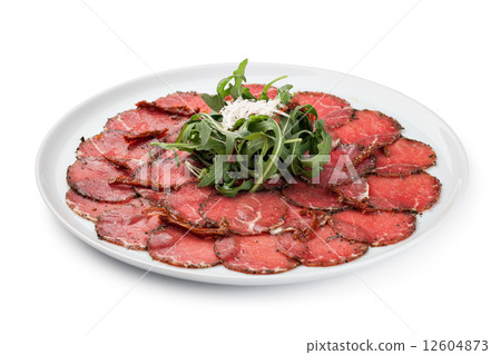 white dish with carpaccio of beef white dish with carpaccio of beef 12604873
