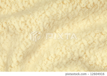 Light yellow crumpled luxury cashmere background. 12604916