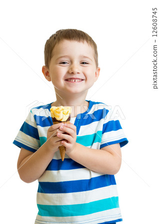 happy kid boy eating ice cream in studio isolated 12608745