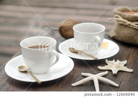 Coffees Cup on wood background for postcard or Poster Coffees Cup on wood background for postcard or Poster 12609840