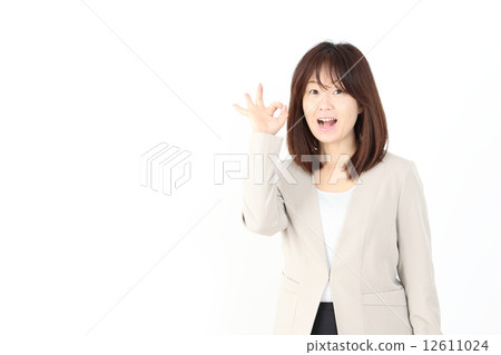 Business woman doing an okay sign 12611024