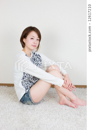 Young woman sitting on physical education 12617210