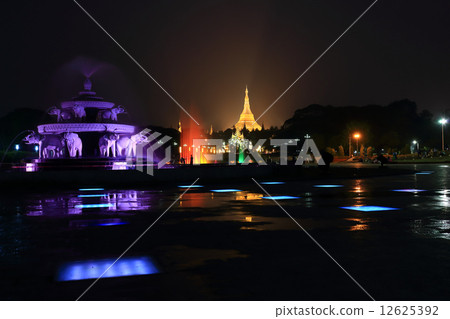fountain with colorful illuminations at night near the Shwedagon fountain with colorful illuminations at night near the Shwedagon 12625392