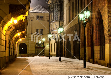 Prague Old Town street with university building at night 12628436
