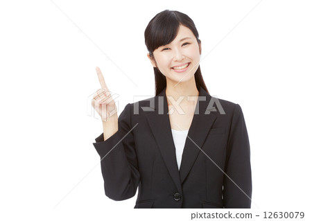 Pointing business woman 12630079
