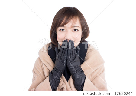 A woman in a coat 12630244