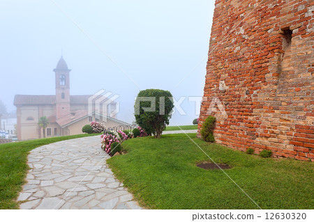 Grinzane Cavour in fog. Grinzane Cavour in fog. 12630320