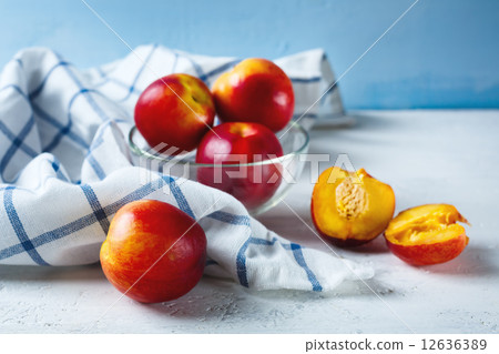 Nectarines on blue background Nectarines on blue background 12636389
