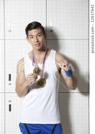 Fit Asian man with sports medal Fit Asian man with sports medal 12637642