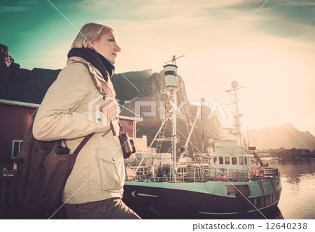 Woman traveler in Reine village, Norway 12640238