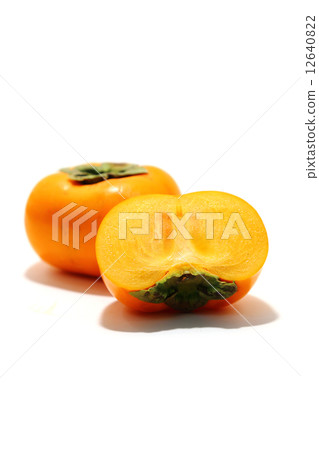 Cut persimmon on white background Cut persimmon on white background 12640822