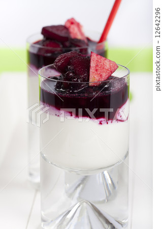 Yogurt and cottage cheese dessert garnished with fruits 12642296