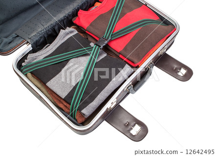 Prepared suitcase with clothing in holiday trip. Close up on white background. Prepared suitcase with clothing in holiday trip. Close up on white background. 12642495