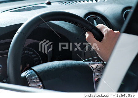 Driving man Driving man 12643059
