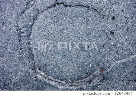 Manhole paved with asphalt 12643494