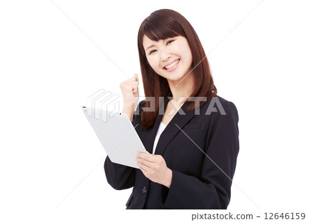 Business woman who takes a tablet and poses guts 12646159