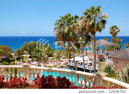 Swimming pool, open-air restaurant and beach of luxury hotel, Te Swimming pool, open-air restaurant and beach of luxury hotel, Te 12646782