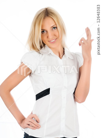 Pretty girl with crossed fingers 12648383