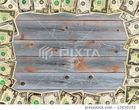 Frame from the dollars on the wooden board 12650183