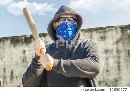 Man with a baseball bat at outdoor  12650377