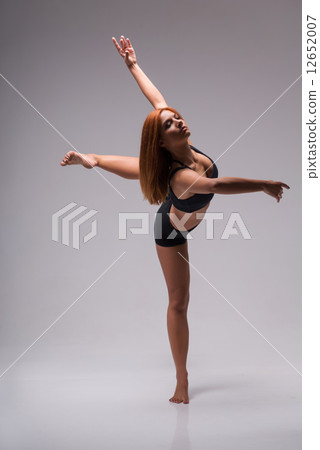 Woman gymnast stretching Woman gymnast stretching 12652007