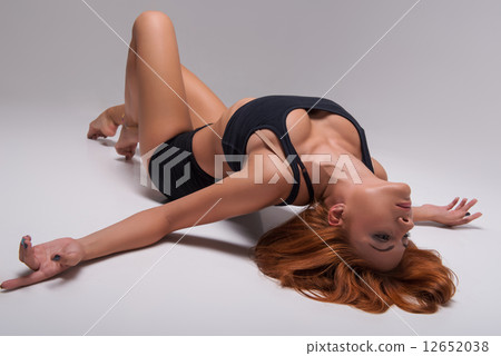 Woman gymnast stretching Woman gymnast stretching 12652038
