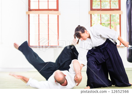 Man and woman fighting at Aikido martial arts school Man and woman fighting at Aikido martial arts school 12652566